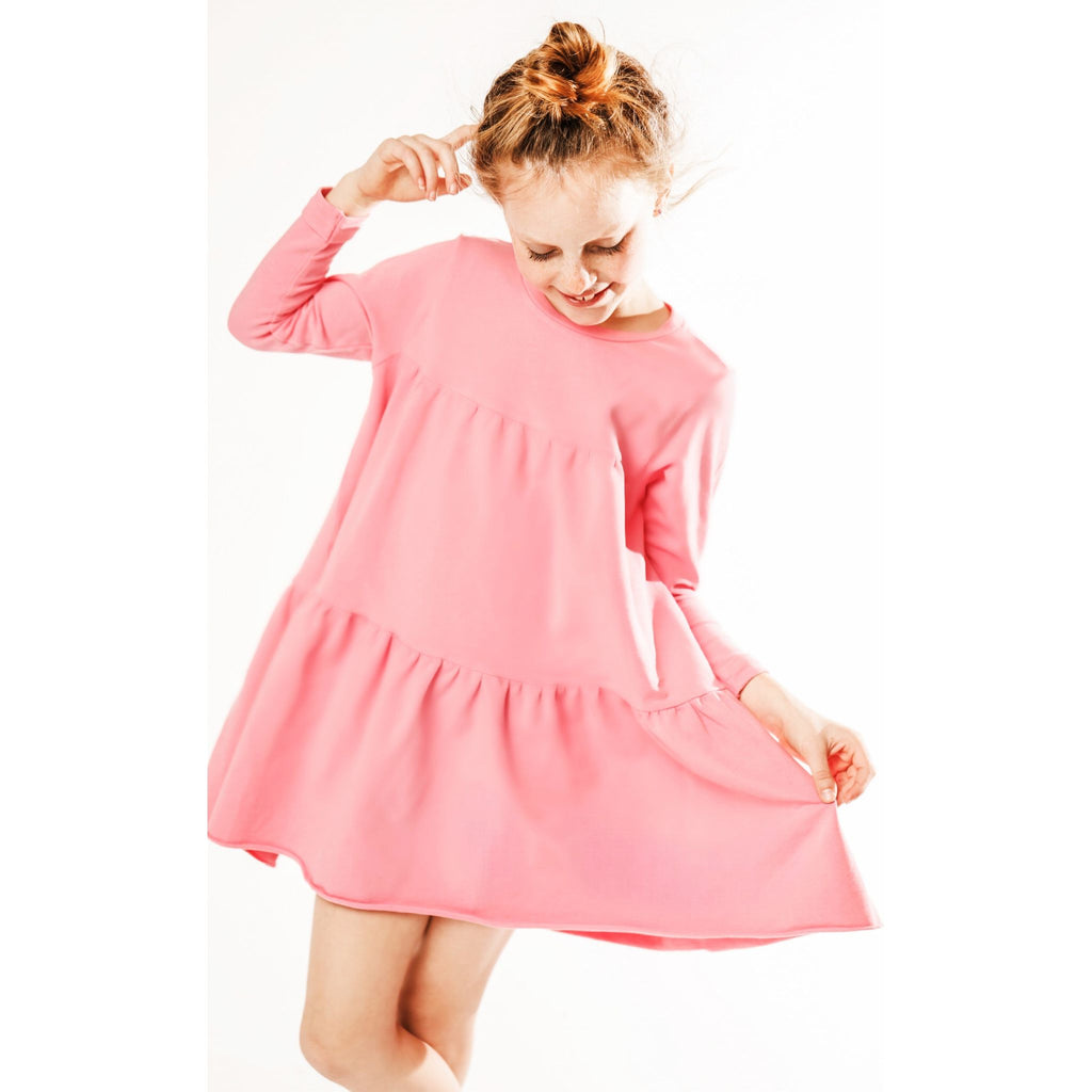 little girl wearing organic pink swing dress